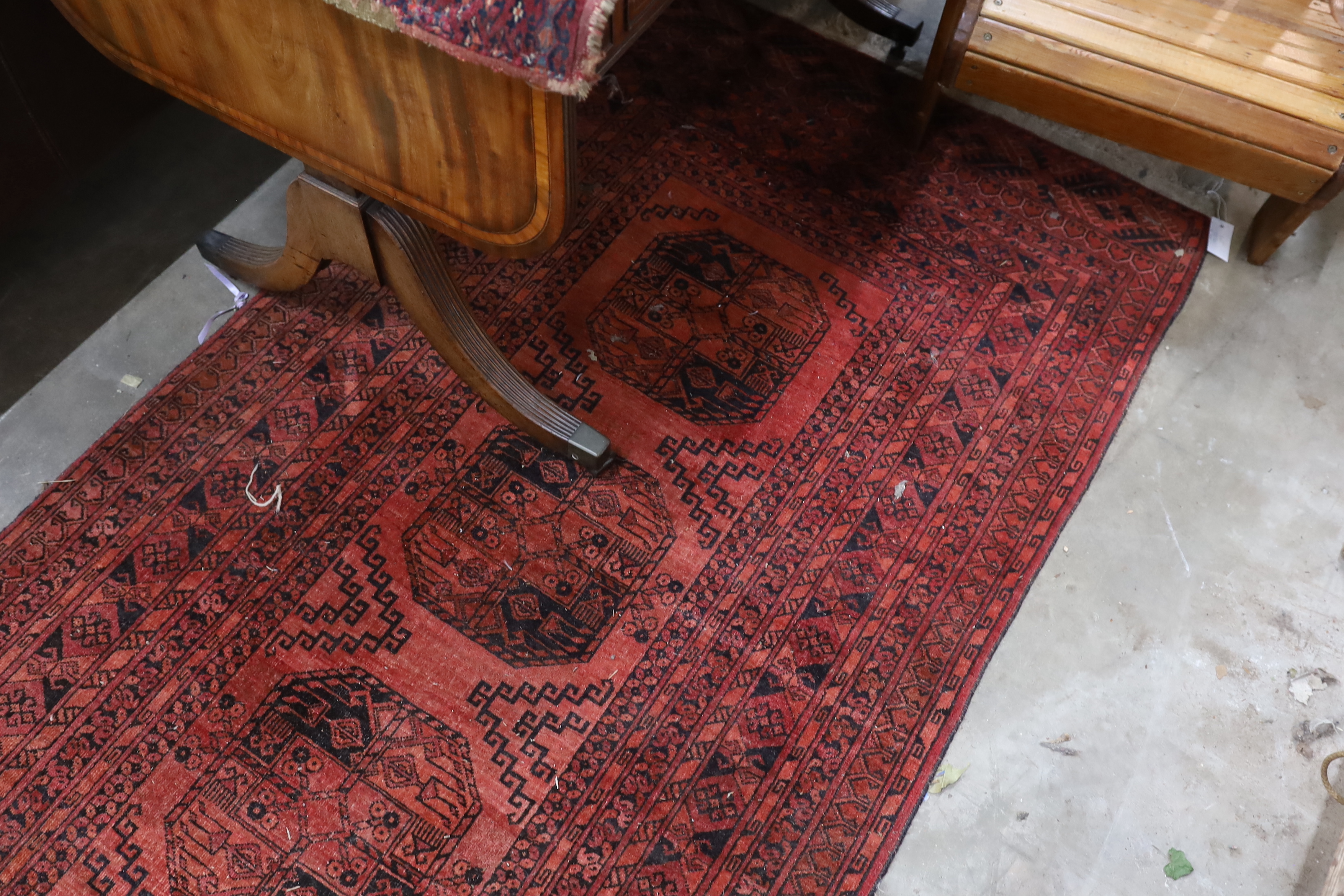 An antique Tekke rug 138cm x 66cm and an Afghan runner 280cm x 104cm.